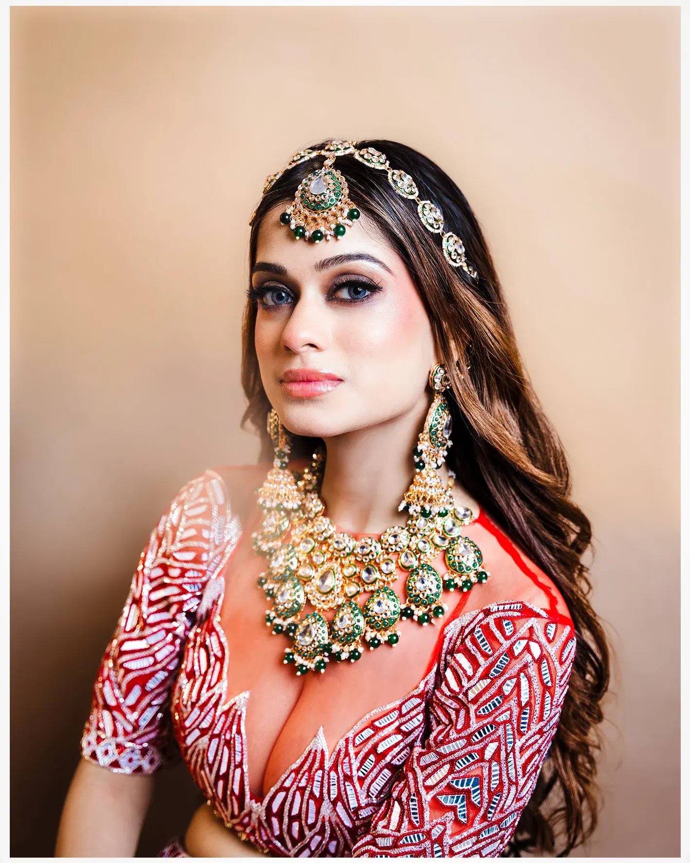 Fashion portrait featuring an ornate headpiece and layered jewellery